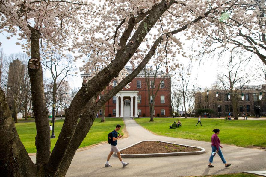 Students walking through the Tufts University campus
