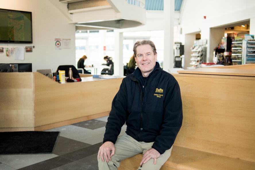 CSO Bentson sits on a bench in the SMFA lobby